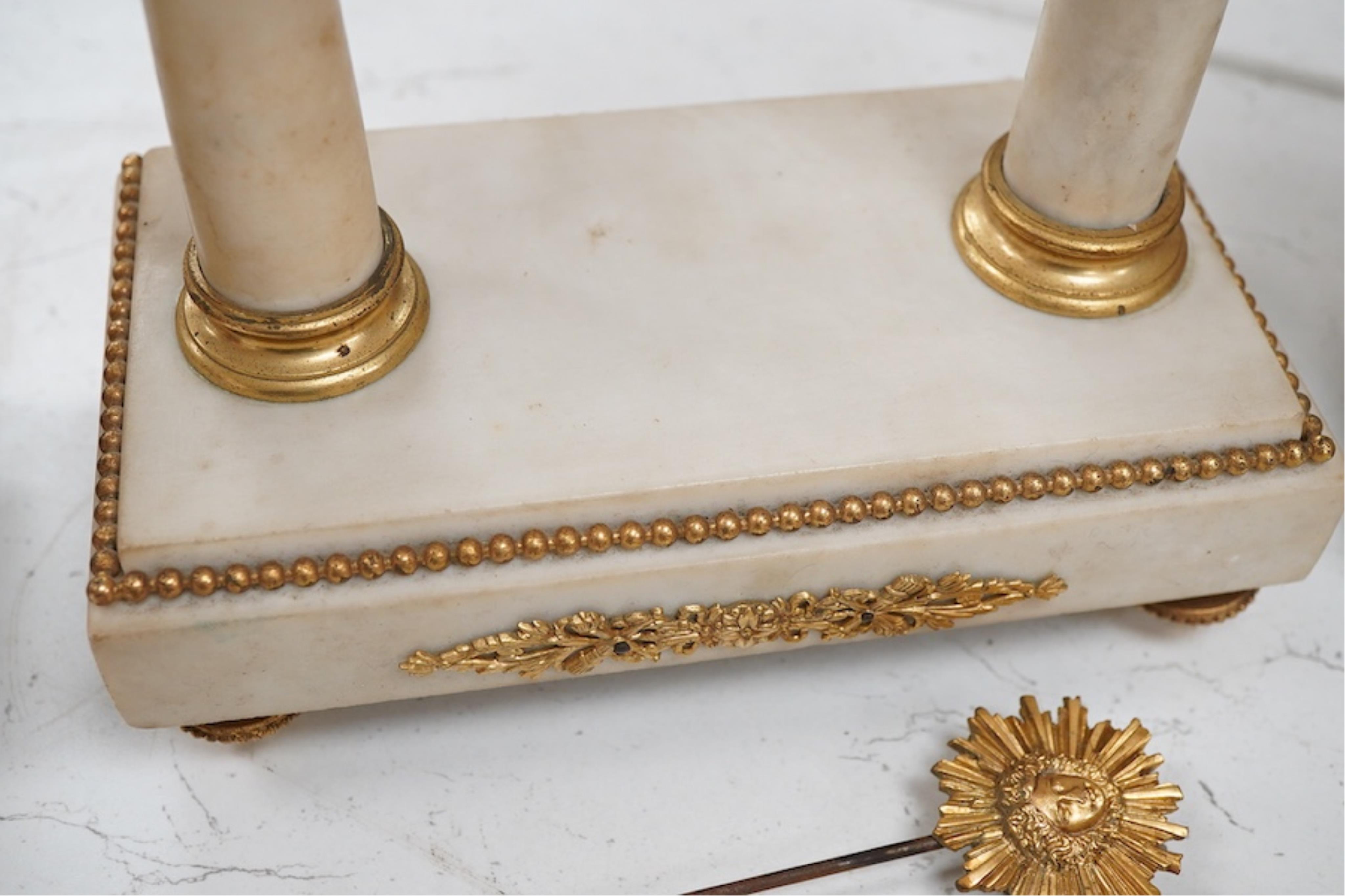 A late 19th century French gilt metal mounted clock garniture, 41cm